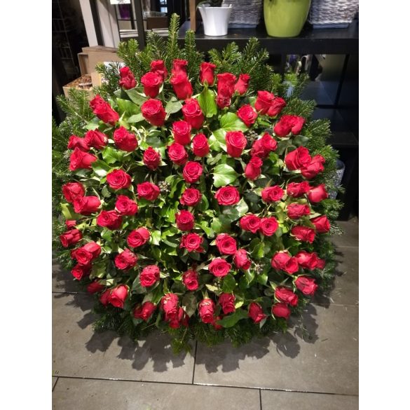 Huge funeral wreath full of roses