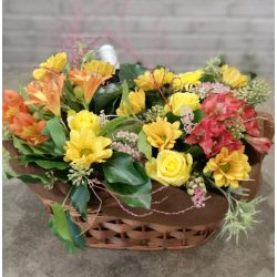 Colorful flower basket with champagne